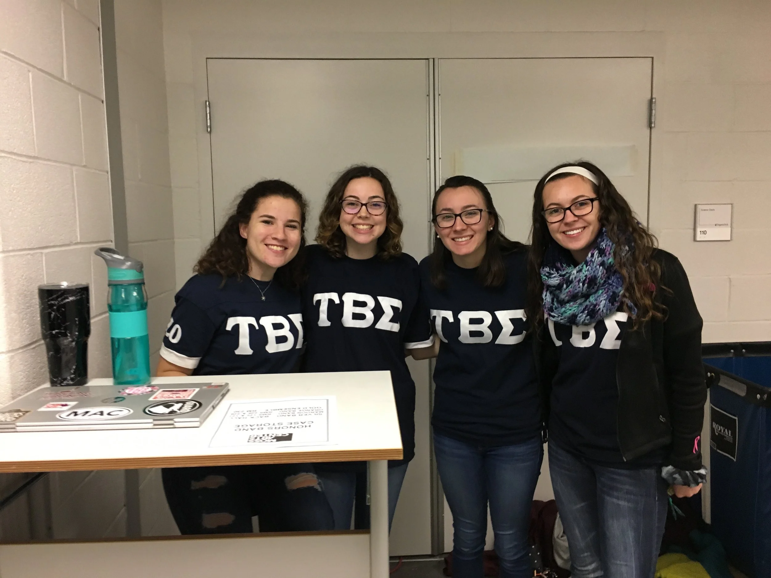 Members of Tau Beta Sigma assisting with Honor Band (from left to right: Lexie Hackman, Kaelyn Knott, Karen Small, Alison Ritz); Source: Alana Hassett
