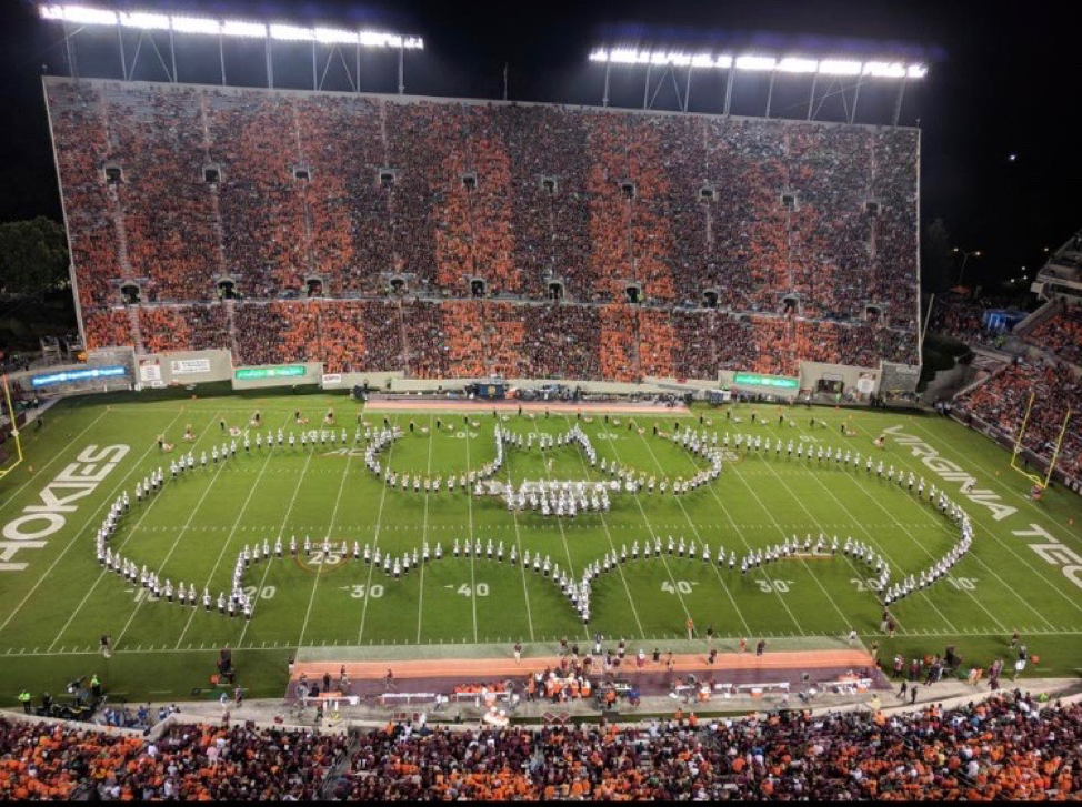 The Marching Virginians forming the Batman symbol during the Superhero show; Source: Matt McHugh
