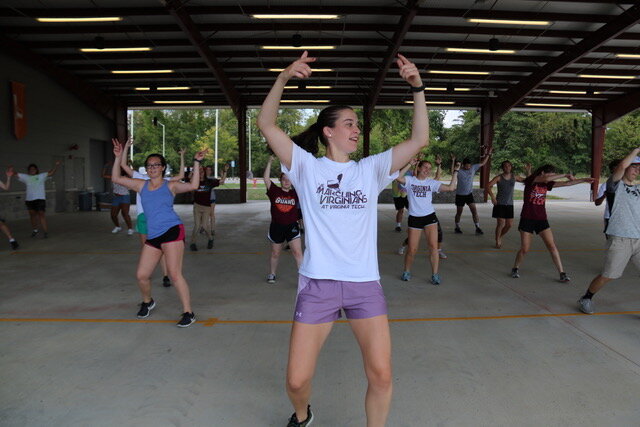 Ashlyn leads the group in a practice run of the whole routine; Source: Emery Poulsen