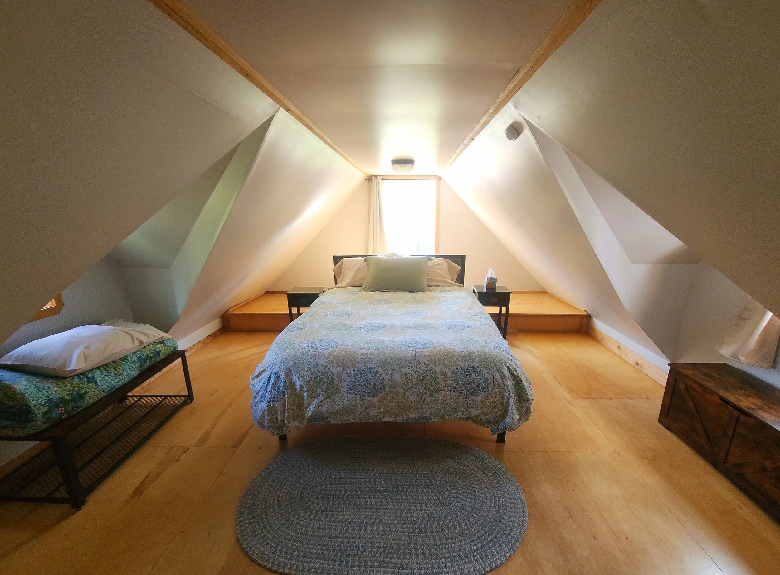 Meadow Cabin's loft with a queen-sized bed. 