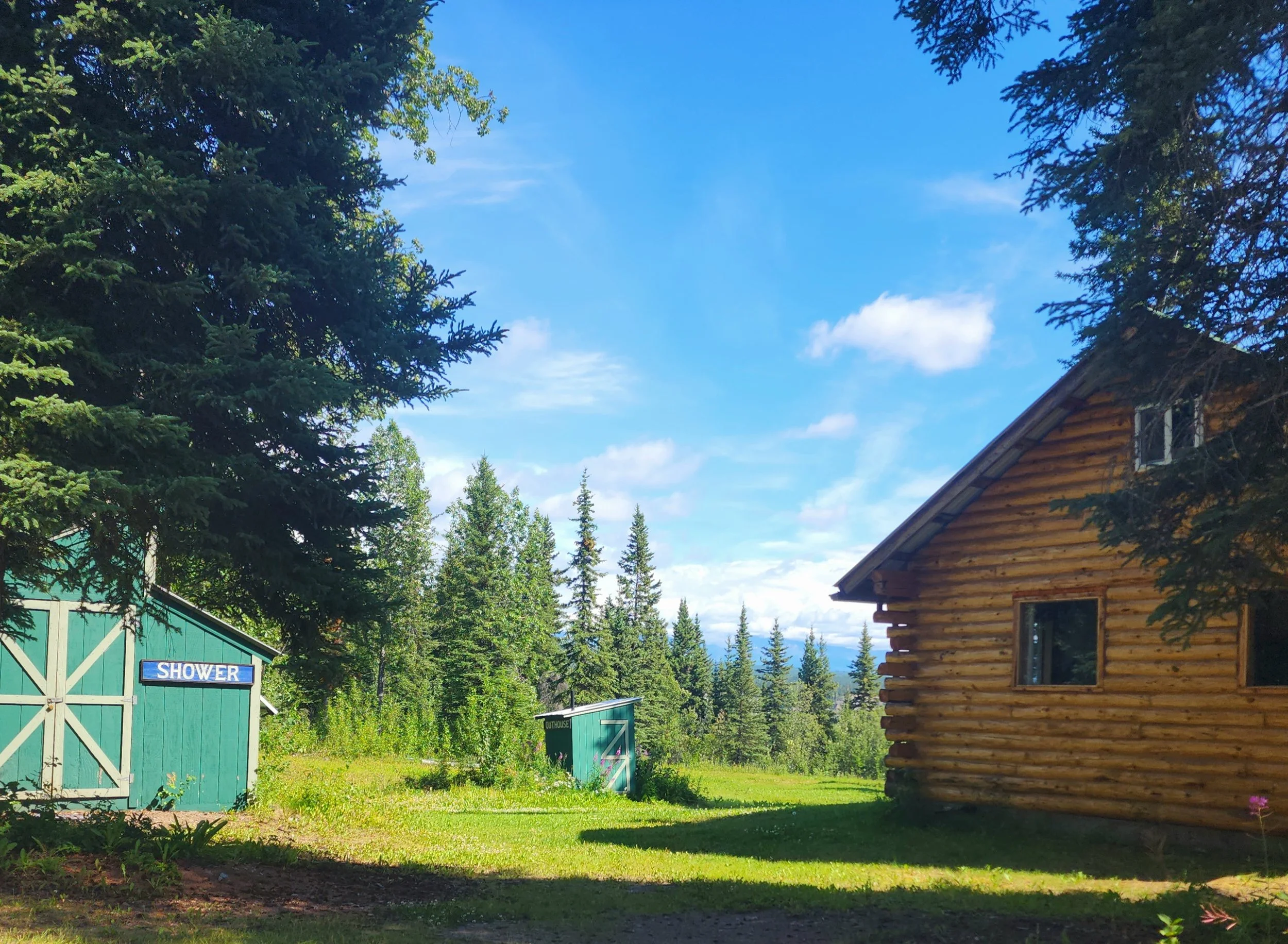 Bluff's shower &amp; outhouse are close to the cabin. 