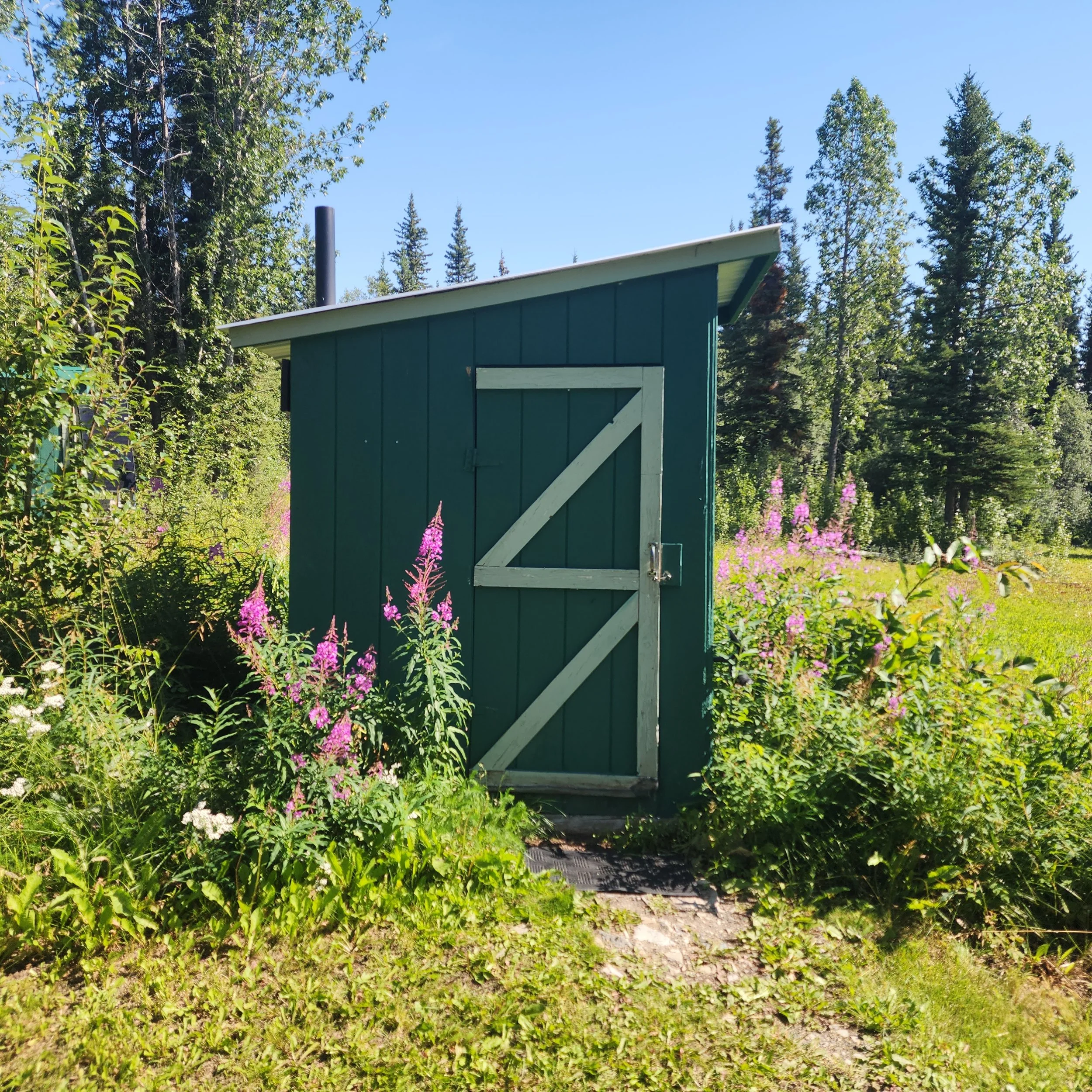 Bluff's well-maintained outhouse with a view.