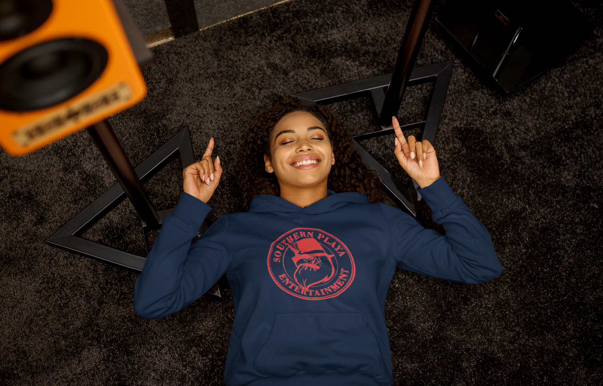 pullover-hoodie-mockup-of-a-woman-listening-to-a-happy-song-while-lying-on-the-floor-m23291-r-el2.png