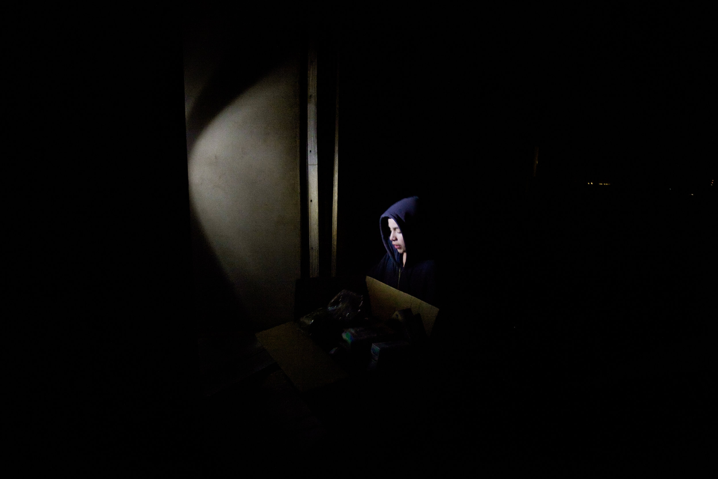  Isidro Alcudia, Jr. brings donated food into his family's trailer in Pajarito Mesa, New Mexico, USA on Feb. 10, 2011. The majority of the family's food is from food stamps and donations. 