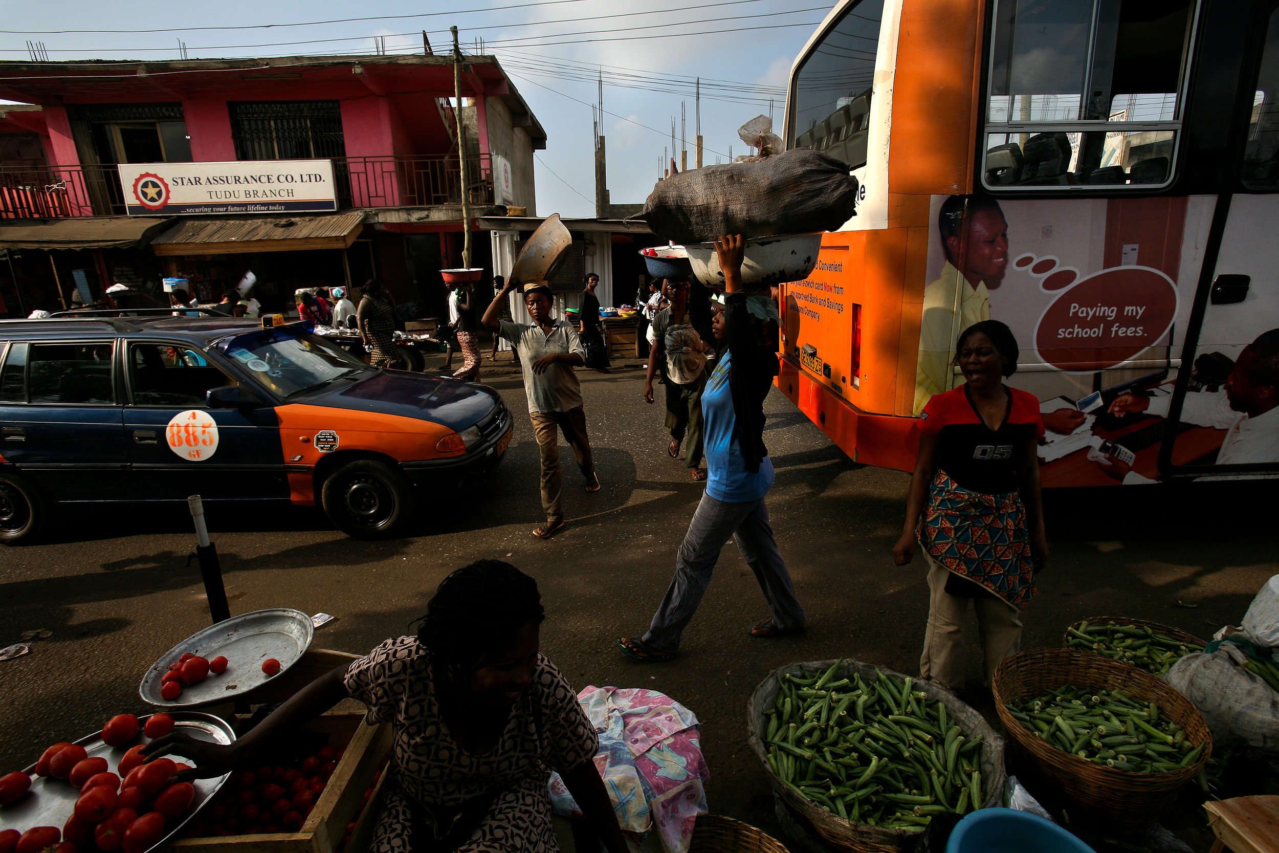  25-year-old Lamisi, center, carries a load of yams from one market to another in Accra, Ghana on Feb. 11, 2009. Lamisi graduated from Senior Secondary School in Tumu, her home in Ghana's remote Upper West Region, but had to travel to the faraway cit