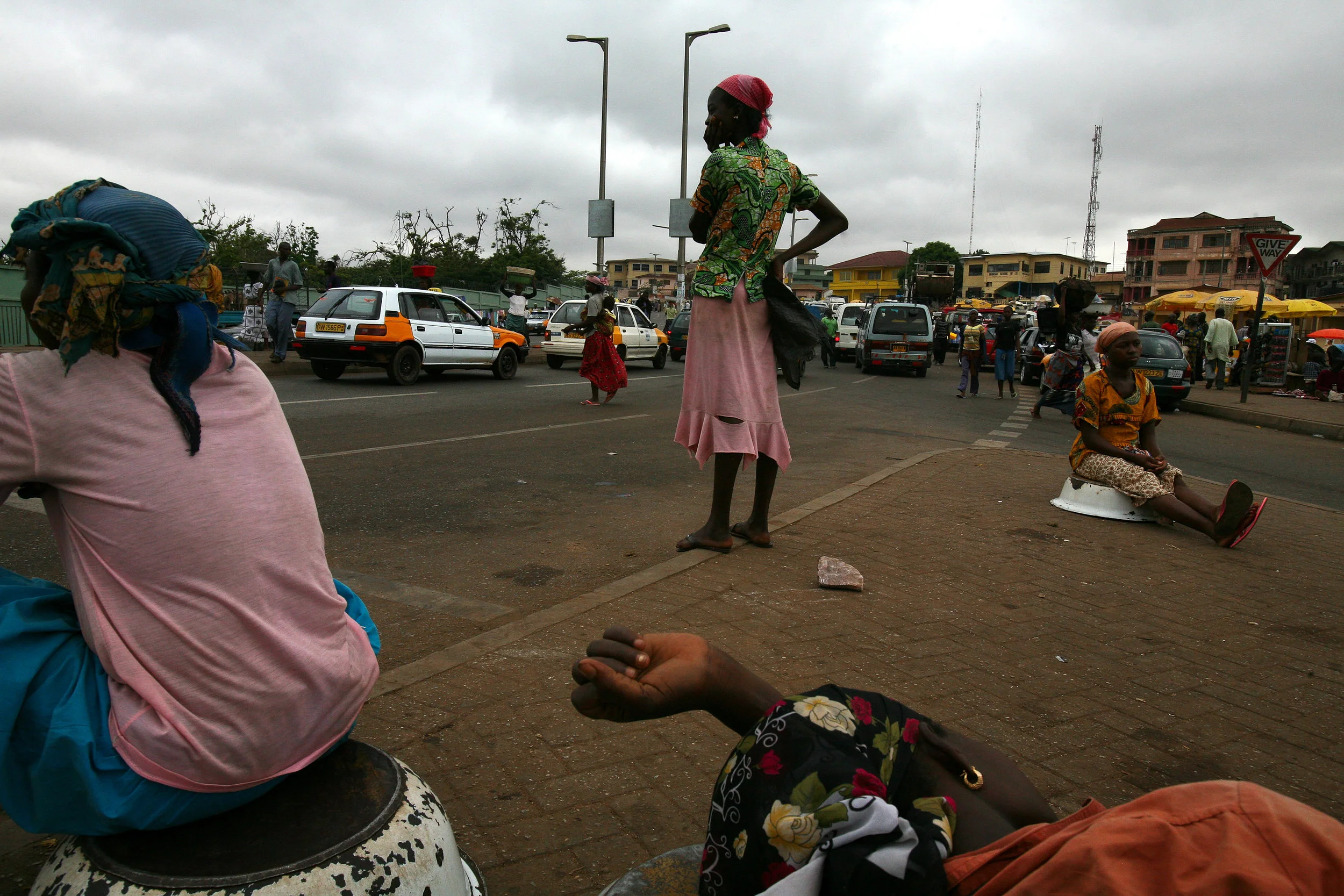Girls from northern Ghana wait for work at an intersection in Kumasi, Ghana on April 10, 2009.