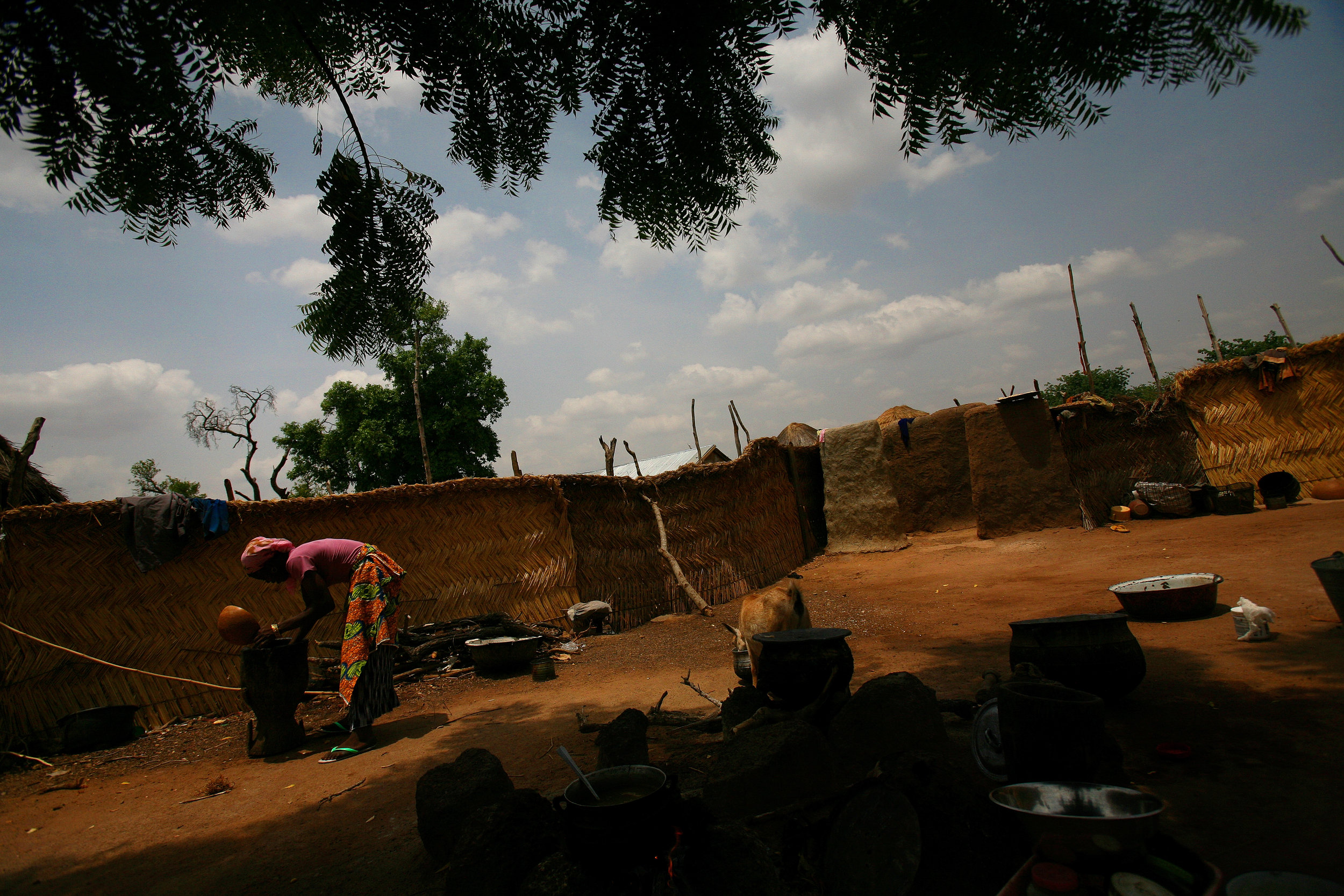  Amariya does chores in her husband's family's compound in Tampion, Ghana on March 25, 2009. 