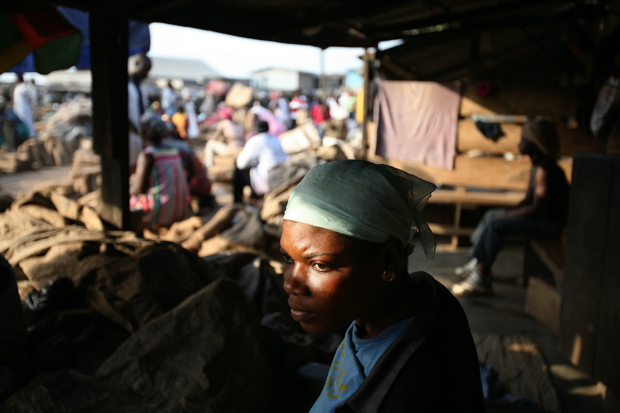 Lamisi sits and waits for work in the yam market in Accra, Ghana on Feb. 11, 2009.