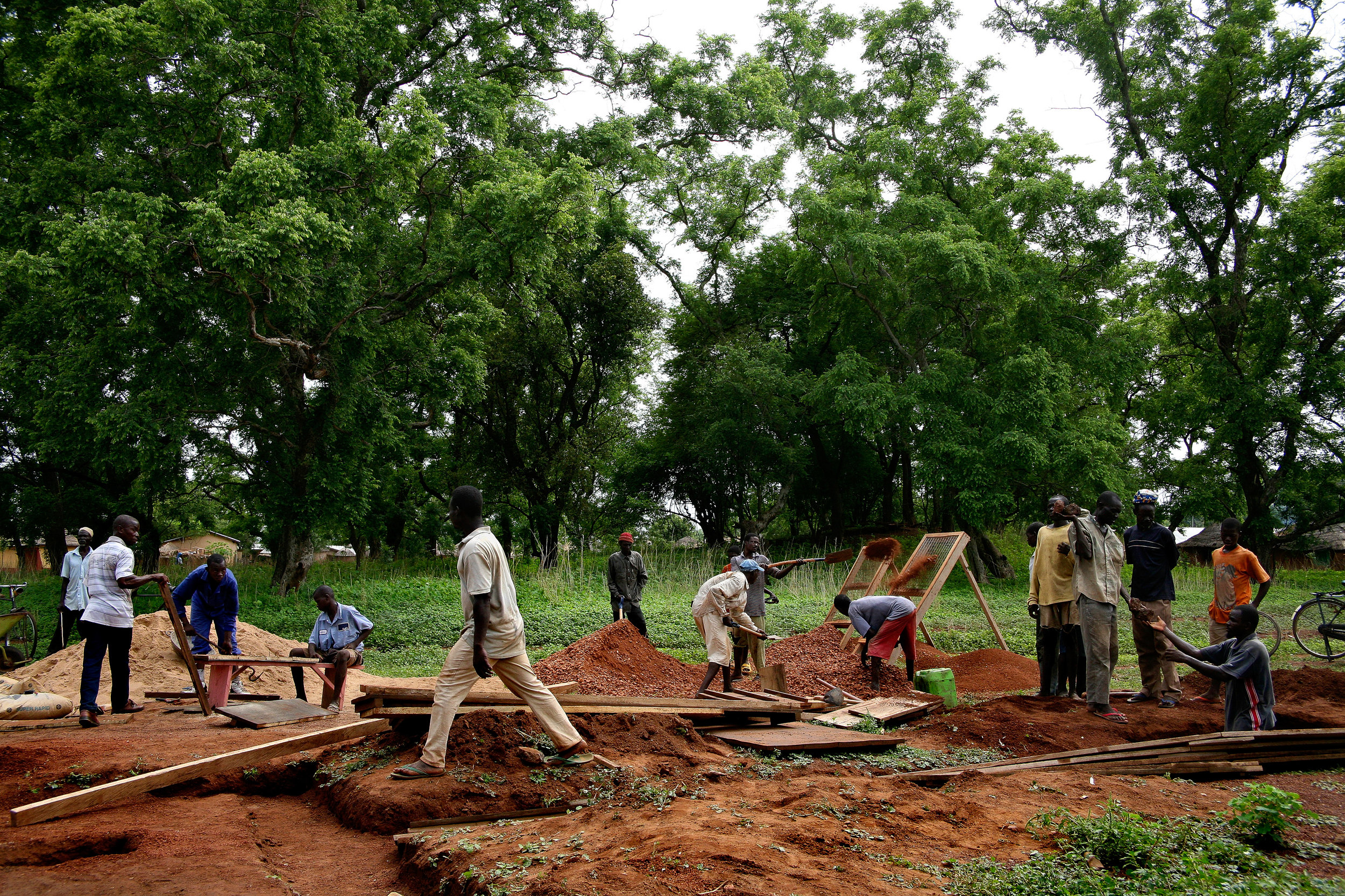  Community members build one of the distribution points for the new water system being built in Wantugu, Northern Region, Ghana on May 16, 2007. The system pumps clean water that is free of Guinea worm to the midst of the village, allowing people to 