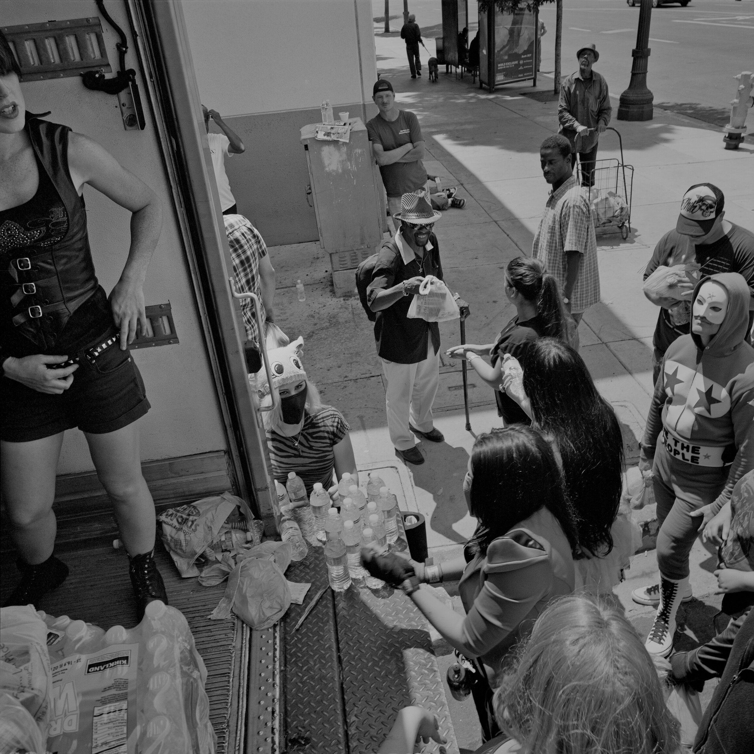  Superheroes hand out food to unhoused people during HOPE 2012 in San Diego, CA on July 14, 2012. 