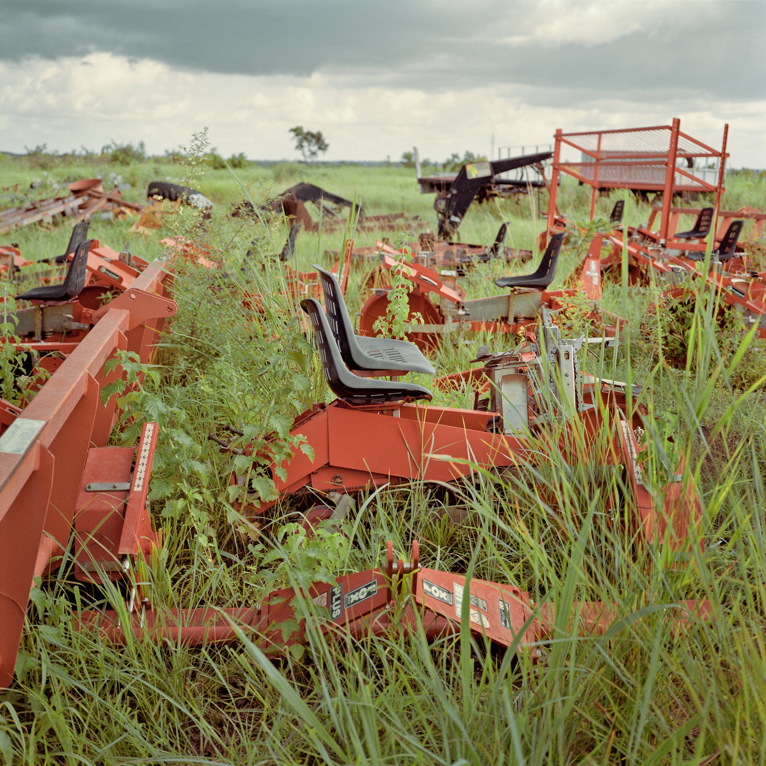  Abandoned tractors. Kpachaa, Northern Region, Ghana. Left behind in approximately 2009, photographed July 5, 2013.   Norwegian company Solar Harvest (formerly Biofuel Africa Ltd) came to Kpachaa in 2007 with a plan to farm the jatropha plant, used a