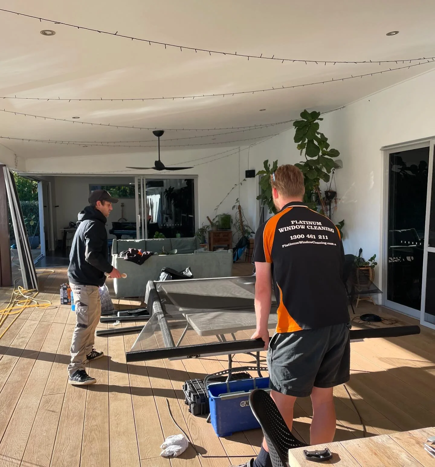 The crew taking on a large window clean and screen replacement job today.