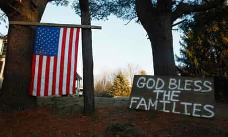 A sign and a US national flag are seen near Sandy Hook elementary school. Photograph: Eric Thayer/Reuters