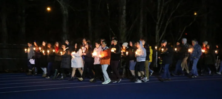 Some of the members of Jr NAA led people around the track at Blue & Gold stadium on February 23 as part of the vigil for the community of Parkland, Fla.