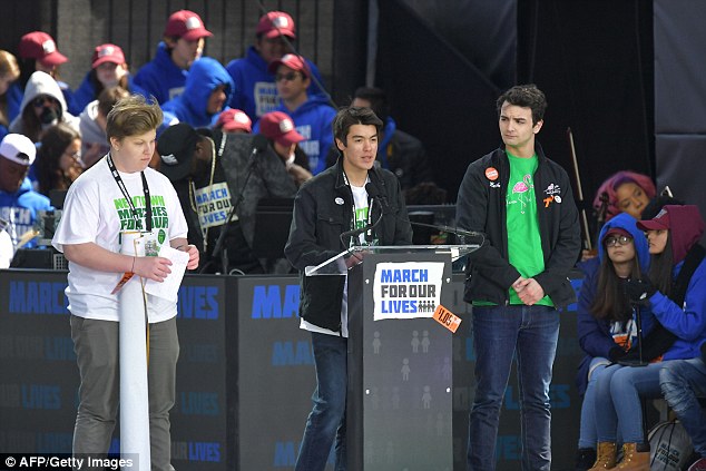 More than 400 people from Newtown attended March For Our Lives in DC, where they heard speeches from Sandy Hook survivor Tommy Murray (center) 