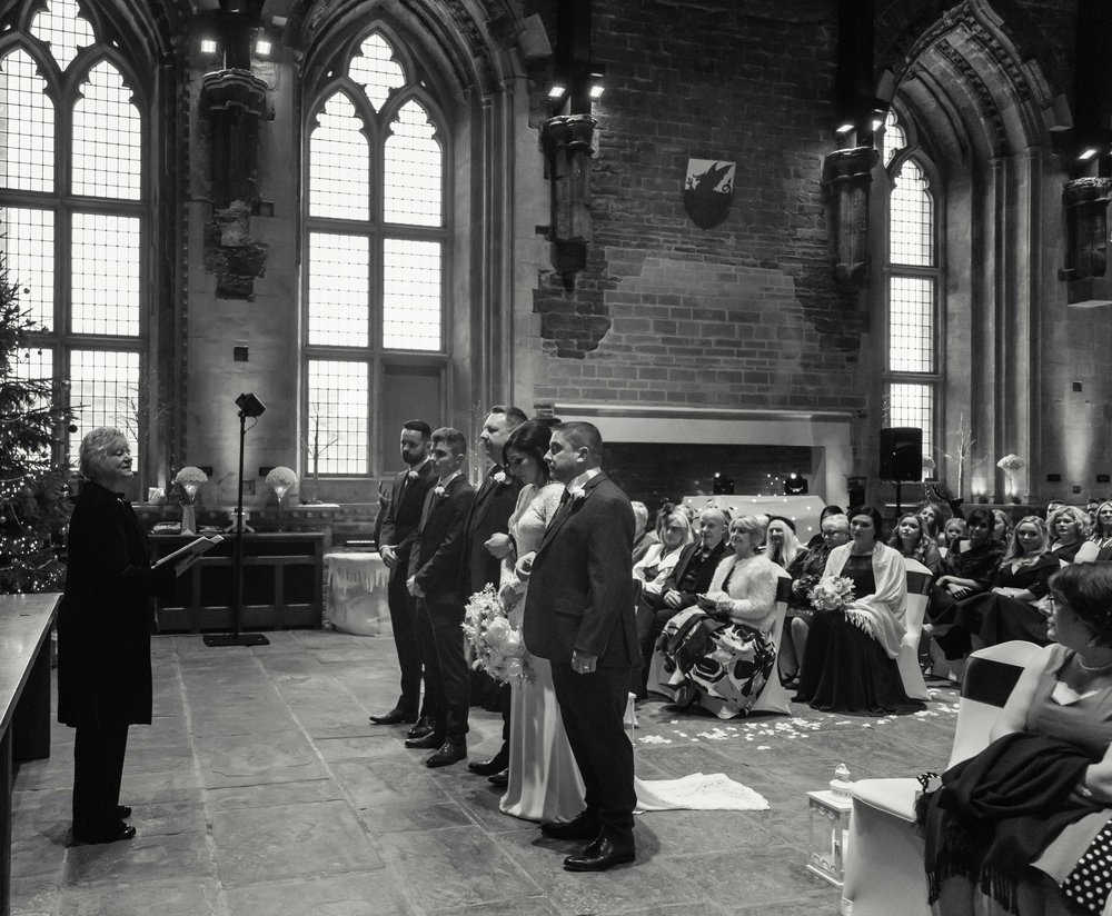 Black and white photograph of wedding ceremony at the Great Hall, Caerphilly Castle