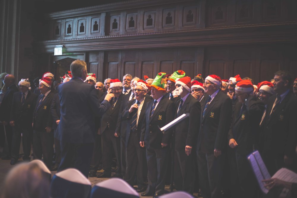 A Welsh male voice choir singing christmas hymns