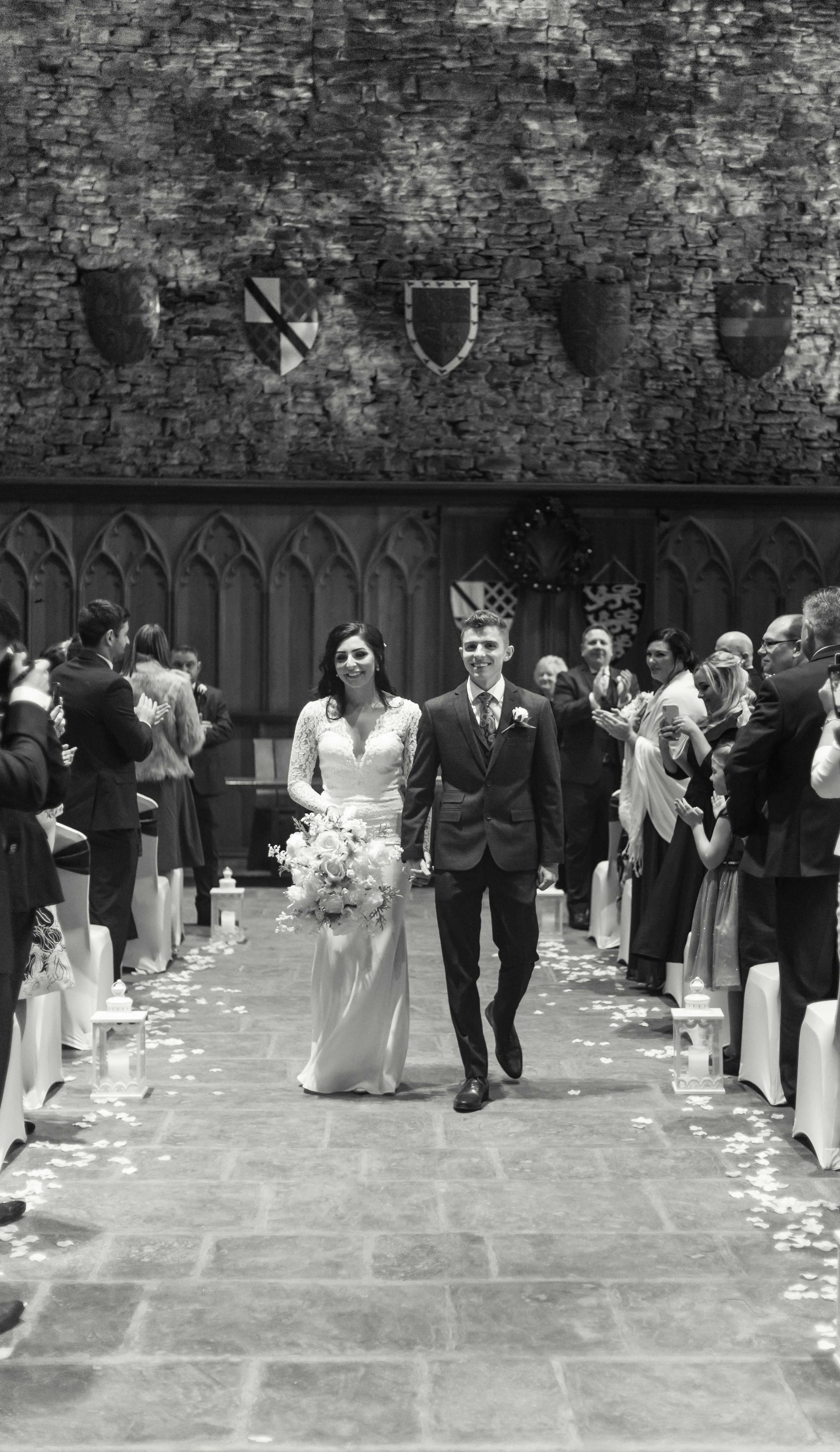 Bride and groom walking up the aisle leaving the wedding ceremony