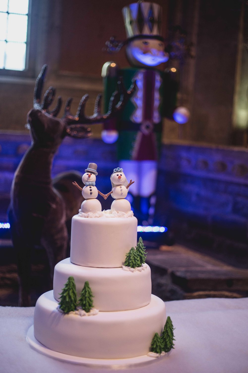 Close up image of a christmas themed wedding cake 