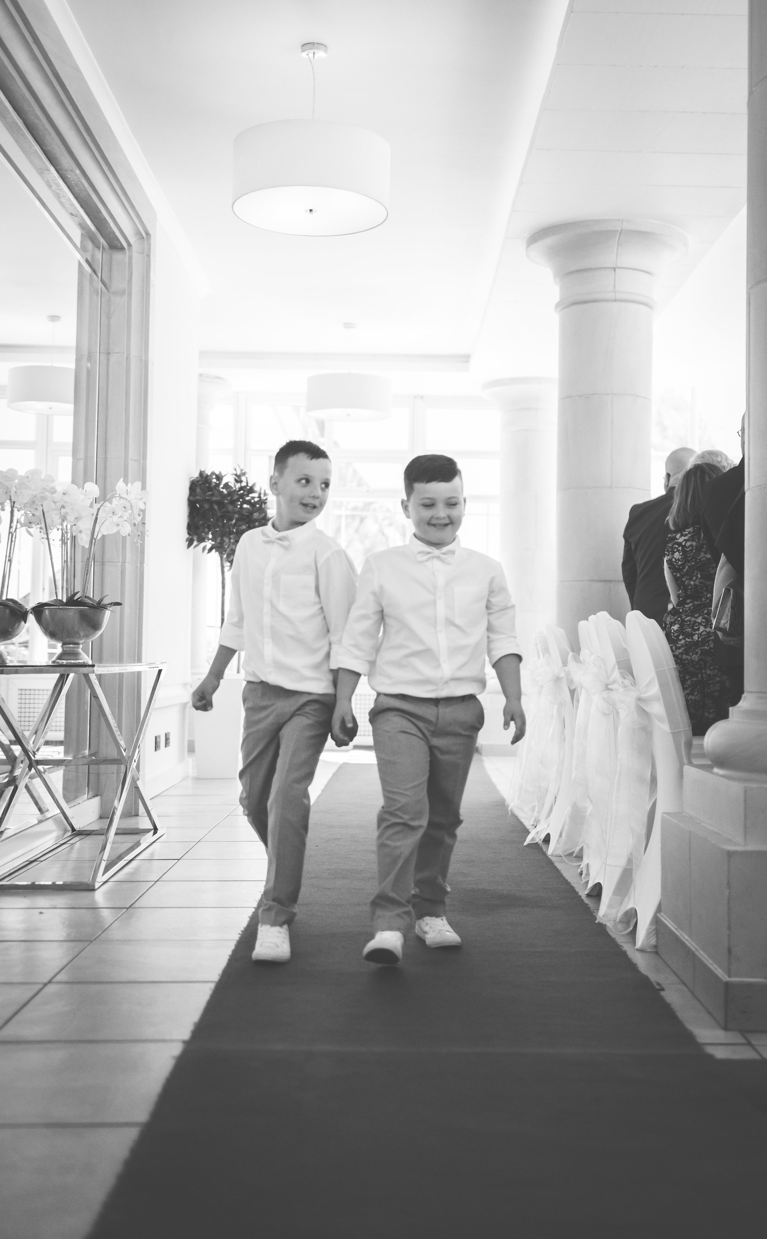 Two flower boys walking up the aisle at a Vale Resort Wedding Ceremony