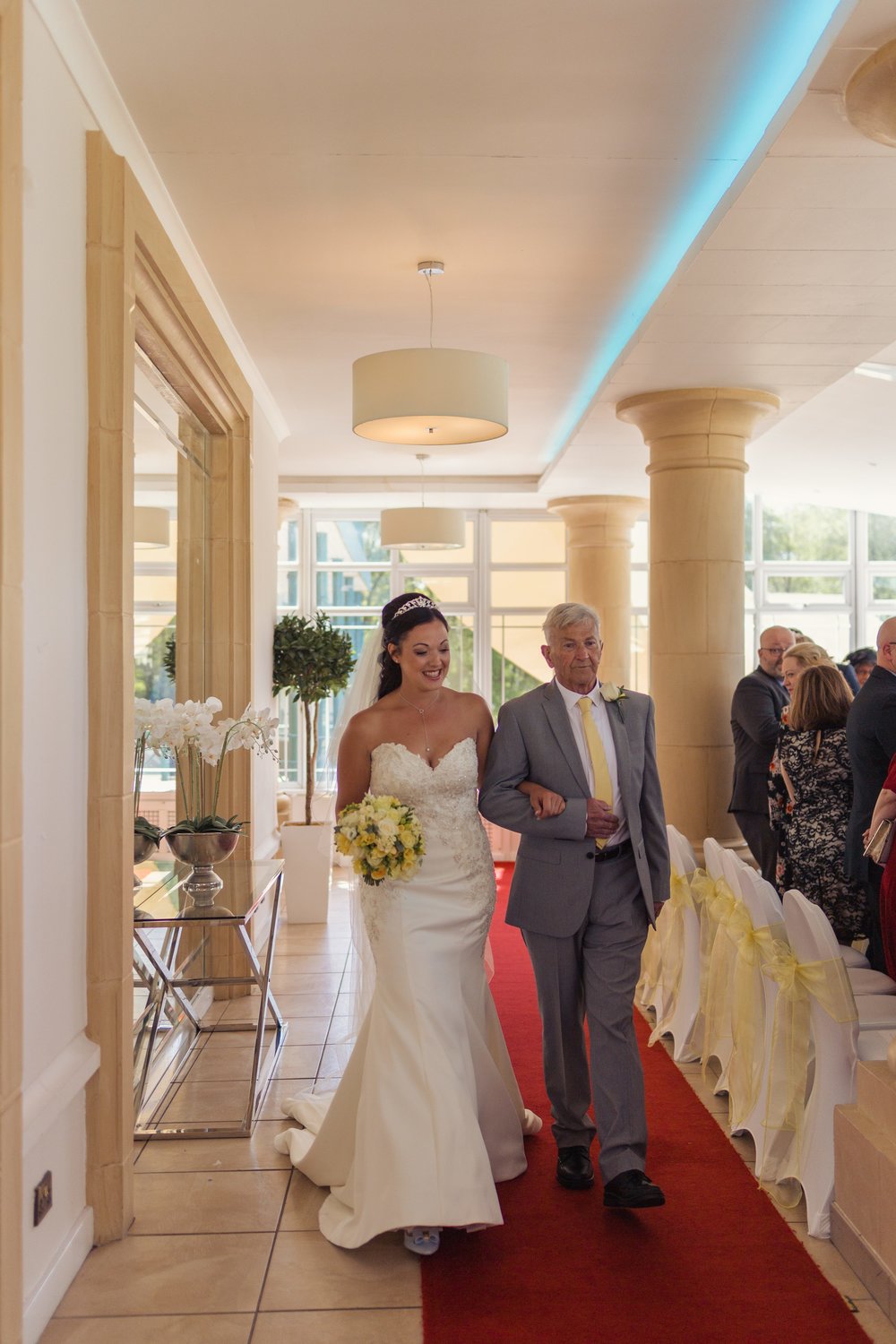 Bride and her father walking down the aisle