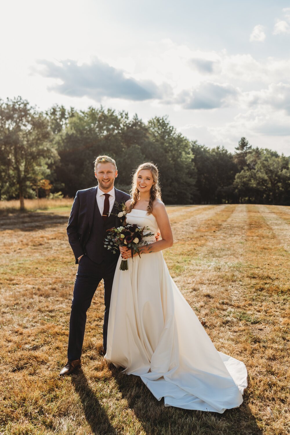 Portrait of bride and groom on the lawn at Chateau de la Valouze