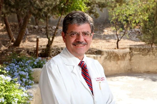 Neurosurgeon fellow and Palestine Hospitaldirector Dr. Nasri Khoury stands next to in Amman Jordan