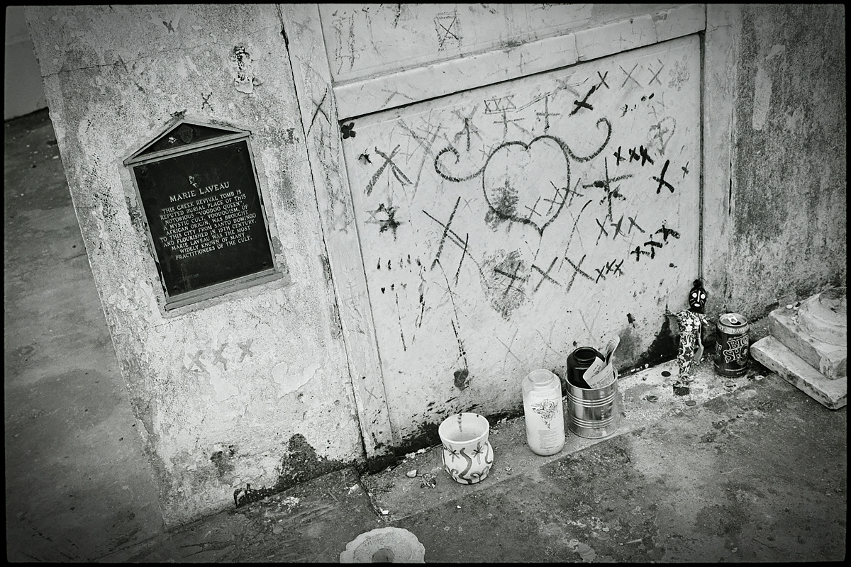 Followers leave markings and mementos at the tomb of Voodoo queen Marie Leveau