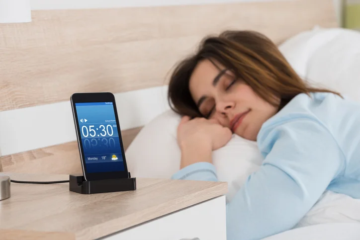 picture of Woman Sleeping With Smart Phone Sleep App