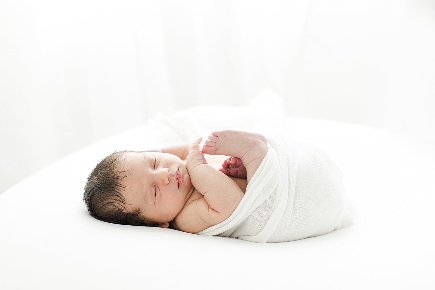Baby boy swaddled for newborn session with Kristin Wood Photography.