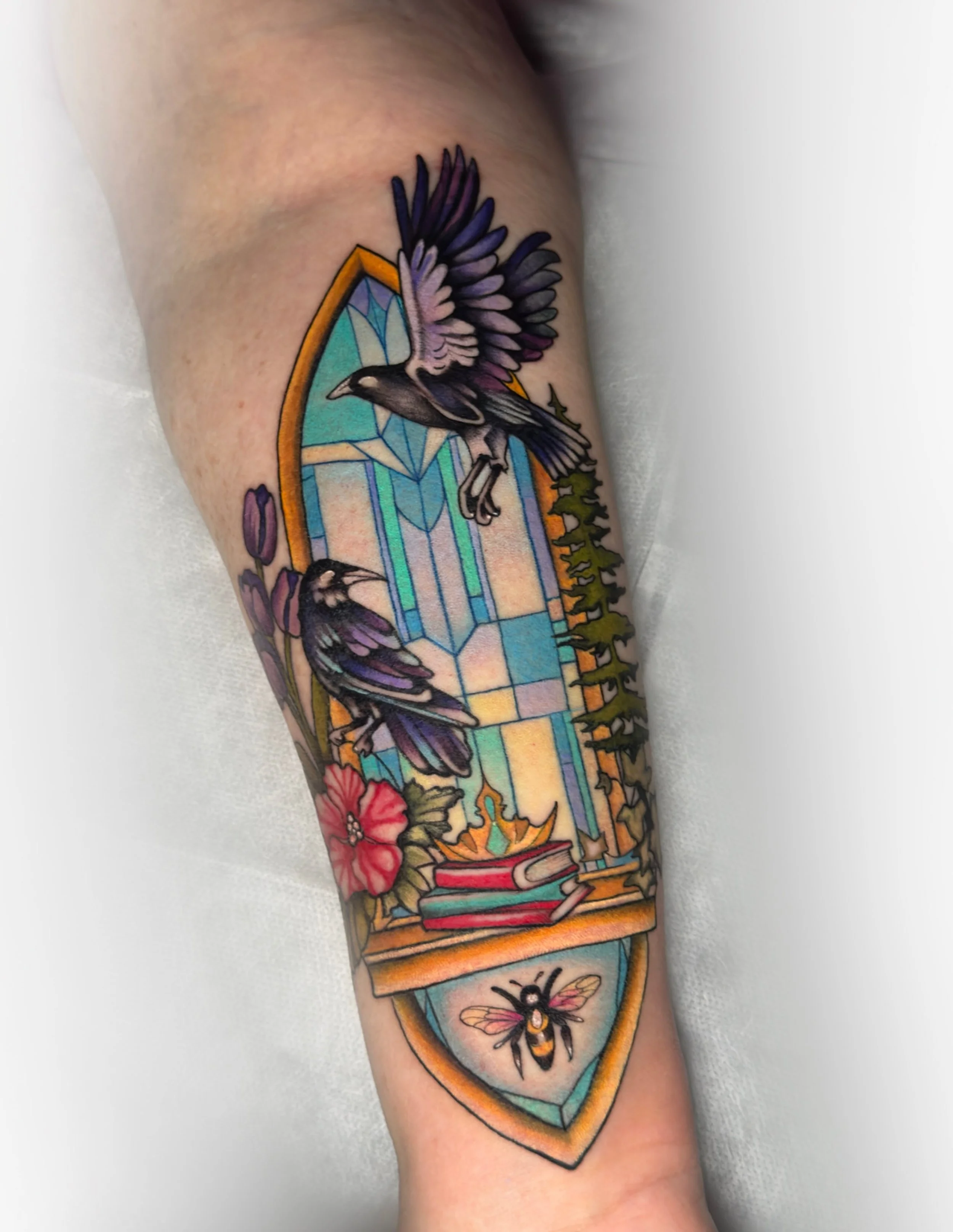 I got to tattoo the second half to this sister tattoo. The original design was made by another artist/creator they had commissioned their design - I just have been lucky enough to tattoo it ! 
I absolutely love books,fantasy,stained glass, ravens , c