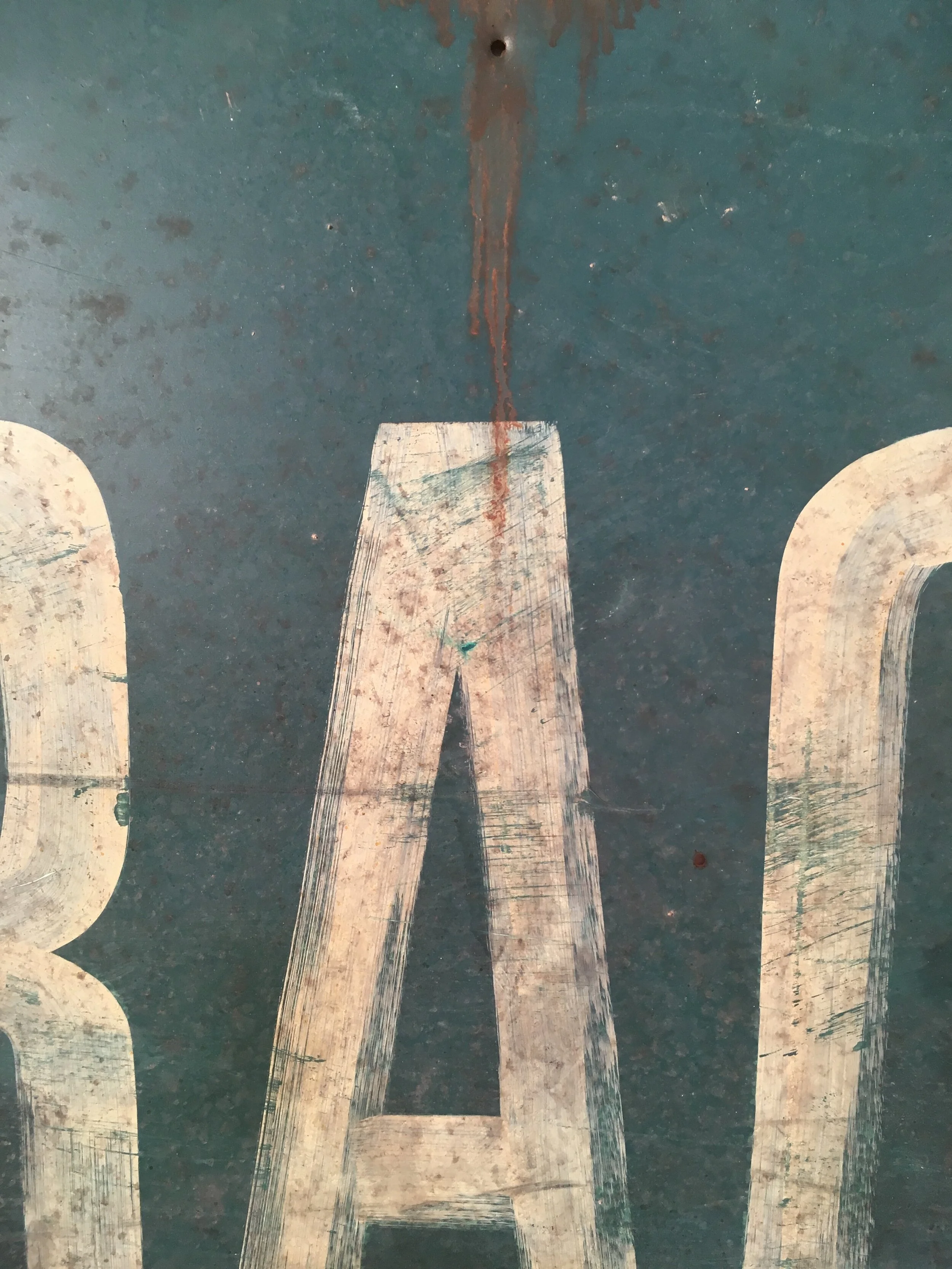  WEST SIDE STORY: DETAIL OF HAND PAINTED AND AGED SIGNAGE  