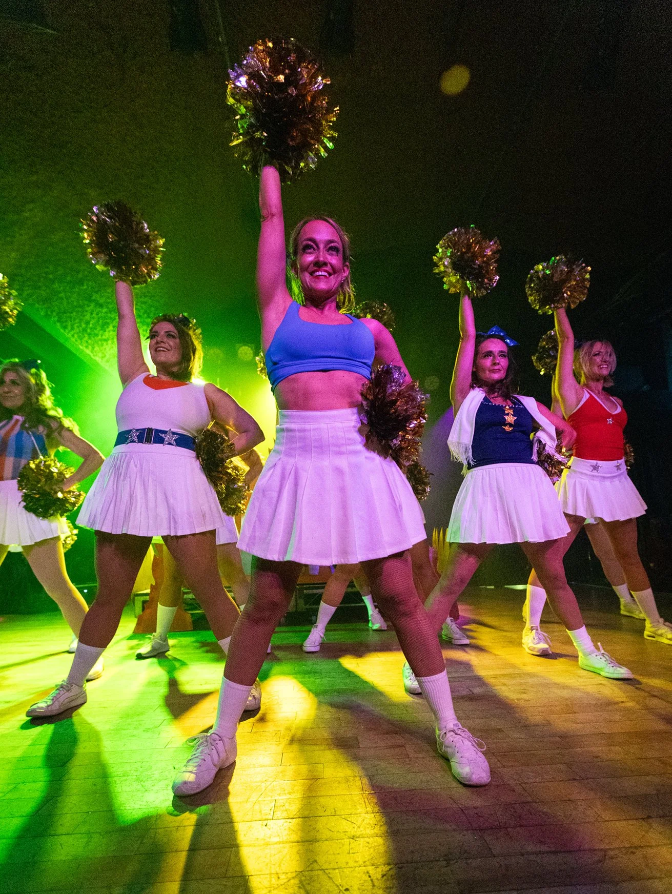 Dancers on stage with pom poms