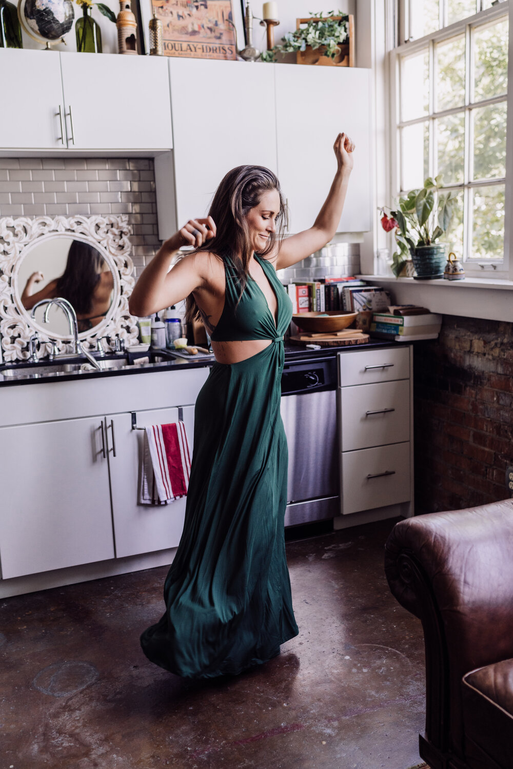 Oklahoma City Boudoir Photographer Dallas boudoir session woman dancing in kitchen
