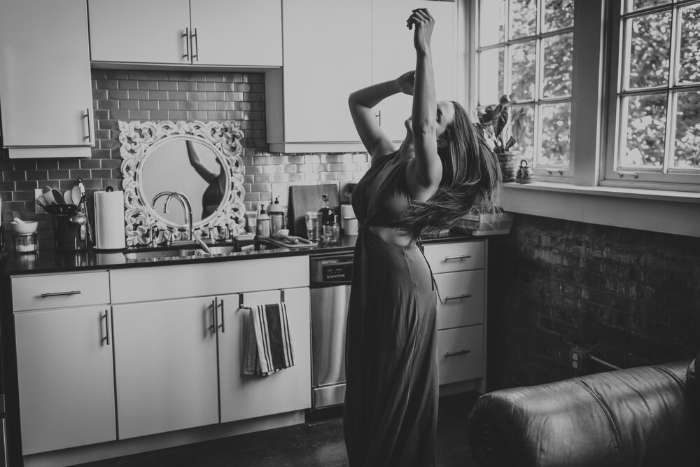 Oklahoma City Boudoir Photographer Dallas boudoir session black and white portrait woman dancing in kitchen