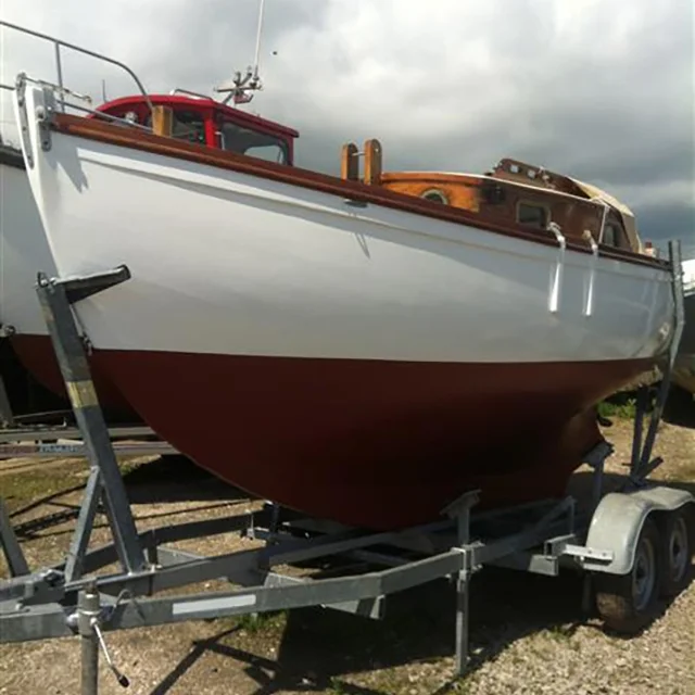 MYTHICAL awaiting the new mast and sail installation before returning to the sea with her proud owner
