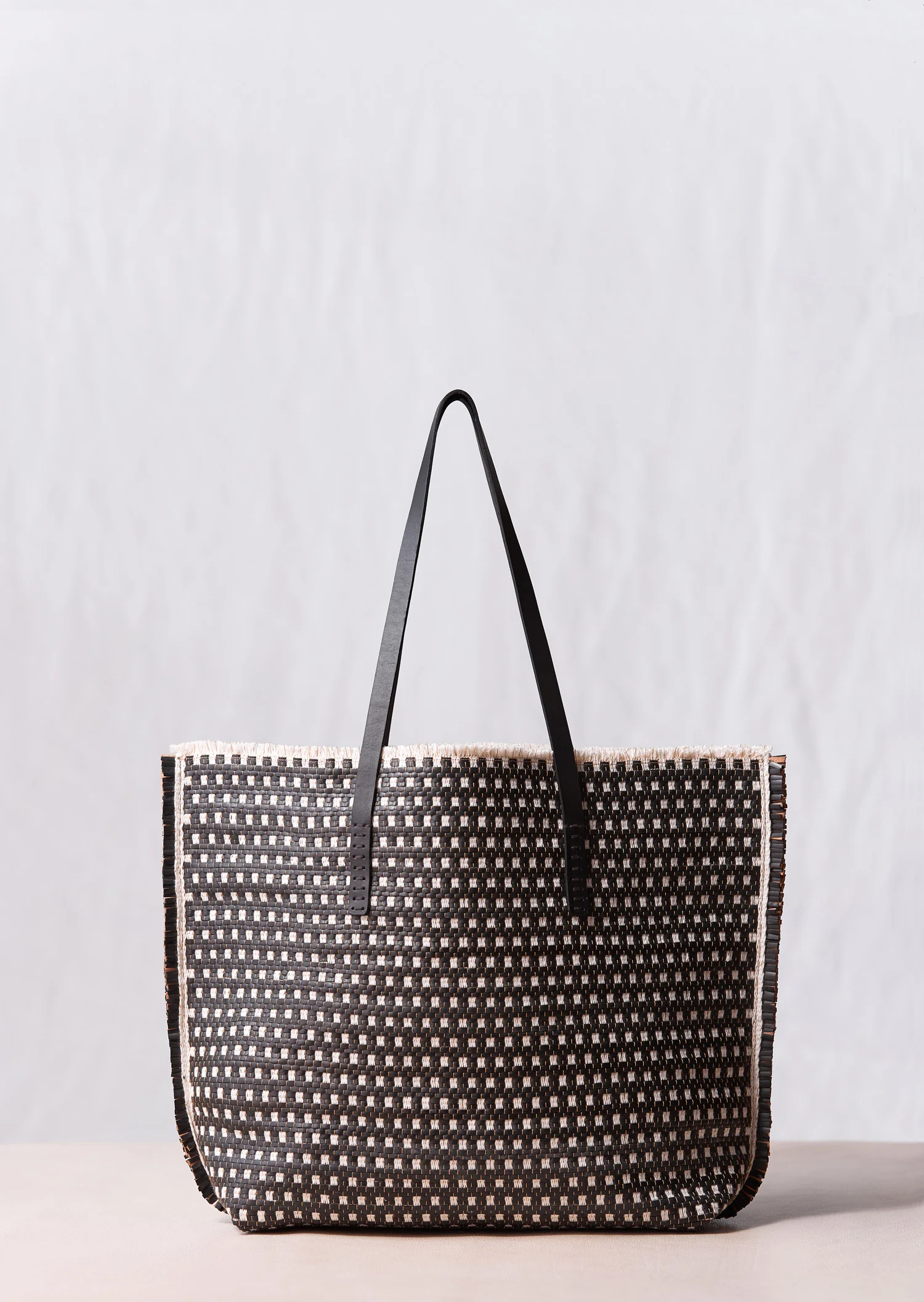 Basket weave. Black and white with vege tan lining_web.jpg