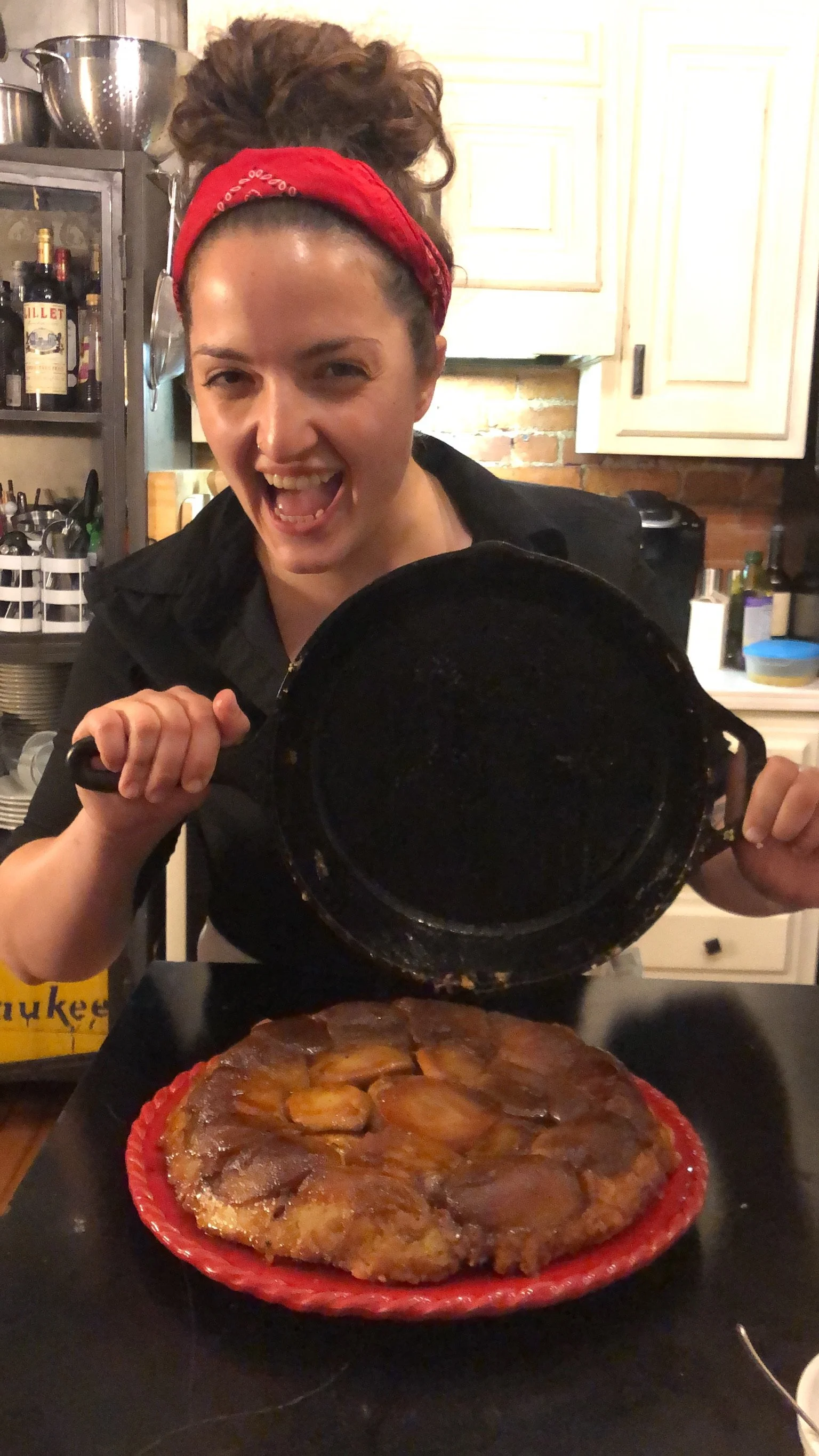  happy-go-lucky chef flipping an apple tarte tatin 