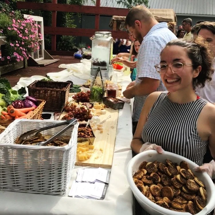  replenishing a grazing board at a wedding happy hour (400 guests) 