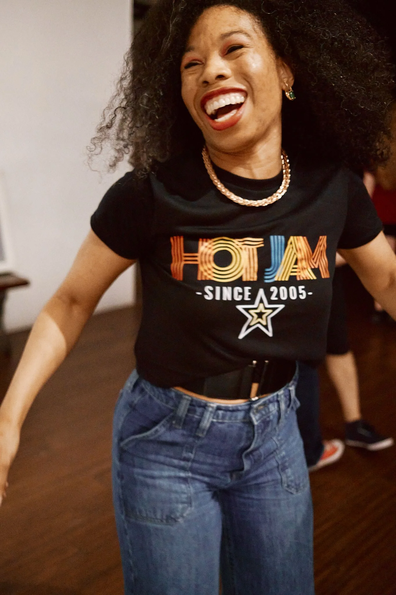 Rachel Laughing in Rainbow shirt photo by Conway Li.jpg