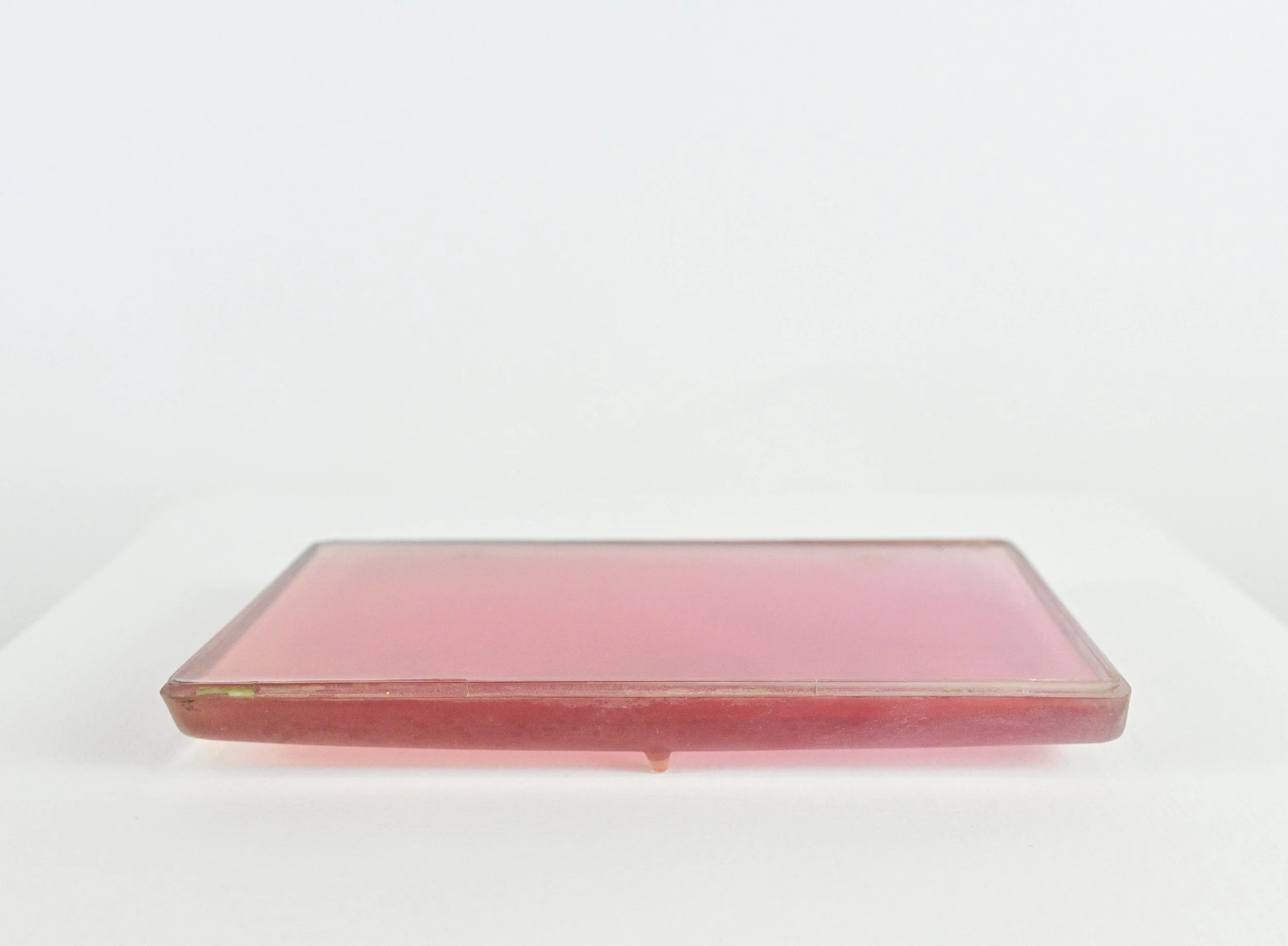 Two toned pink , Found 1990s Volvo headlight lens, resin, 8” x 5 7/8” x ¾”, 2022