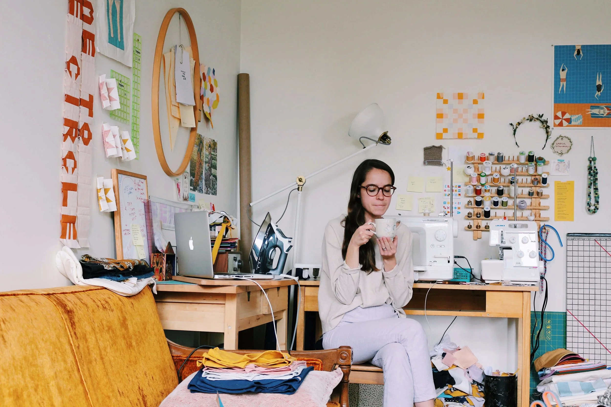 self portrait, in workspace with coffee wearing clothes I made, 2018