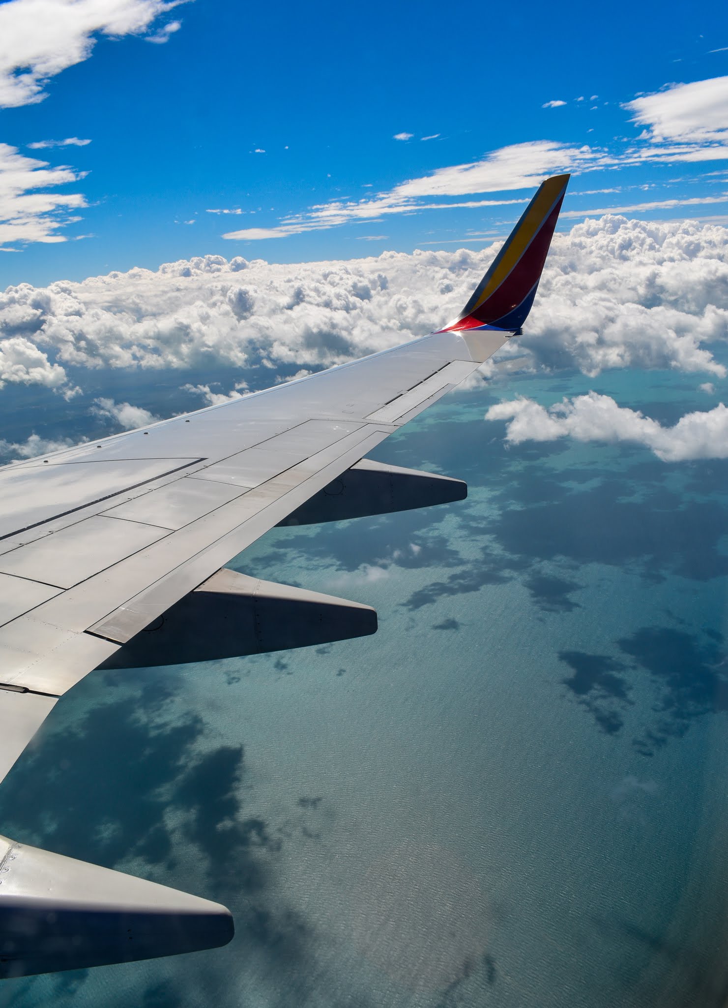 Uprooted-Traveler-Vegan-Weekend-in-Tulum-Mexico-how-to-get-there-airplane-window.jpg