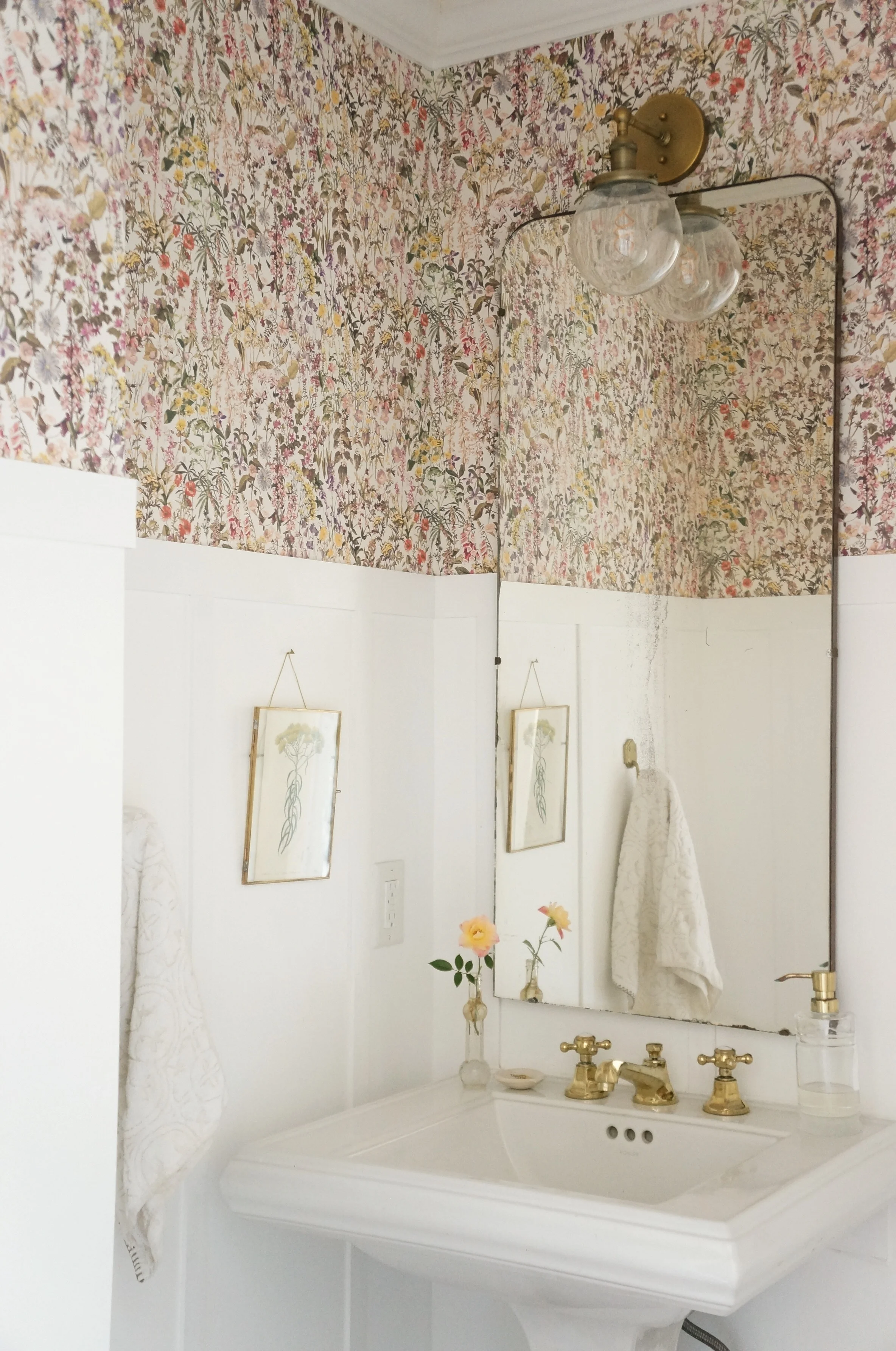 The Liberty of London Wallpaper in our powder room is so feminine and cheerful - it makes me think of Summer all year round.