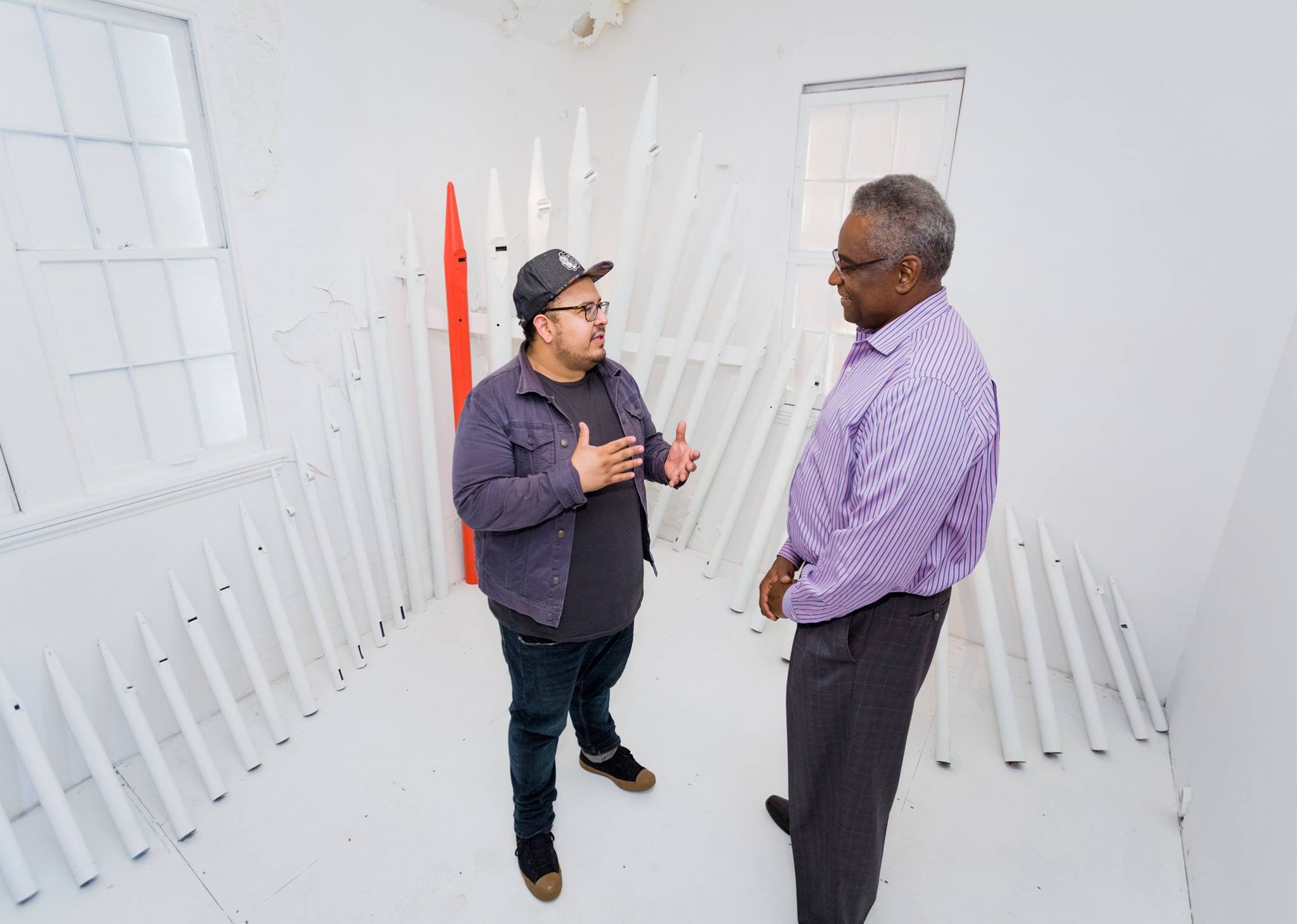 Fernando talking to a guest visiting ArtPrize Nine entry.