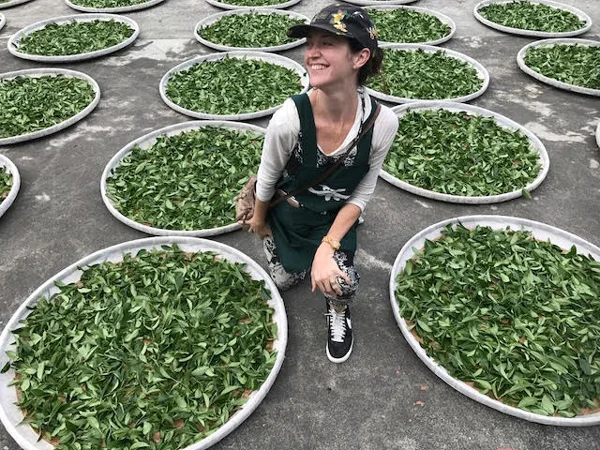 Myself, with the tea leaves we were processing ourselves... this was from the first stage, where they were out for withering and "fluffing".