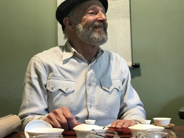 A candid of David Lee Hoffman at his tea table, with his gaiwans, by adoring fan, me!