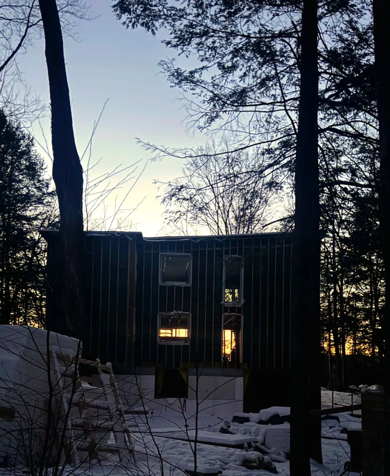 Winter light moving through the Sagamore Residence ❄️🌅

Captured mid-construction, this evening view reveals a signature of River Architects&rsquo; work: long, intentional sight lines that connect interior spaces to the surrounding landscape. Even u