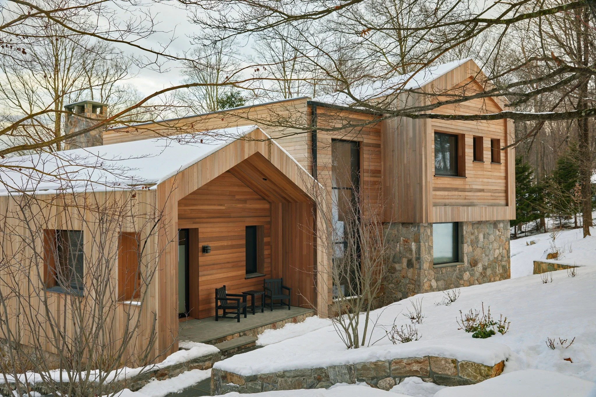 A quiet winter moment at China Pond ❄️

Warm wood and native stone emerge from the snowy landscape, grounding this Passive House in its natural surroundings while offering comfort, durability, and timeless beauty. Designed to honor both place and per