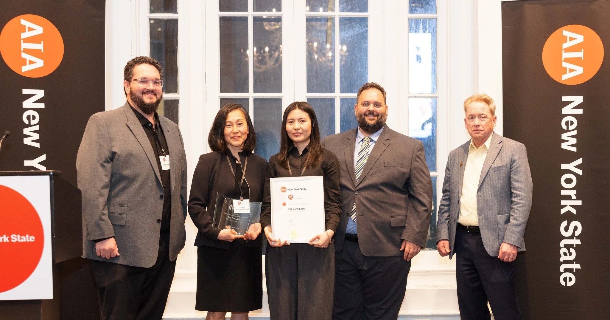 A few weeks ago, Juhee Lee-Hartford and Di W. George accepted a 2026 AIA New York State Excelsior Award for Historic Preservation on behalf of River Architects for The Bank Lofts in Richfield Springs, NY.

We&rsquo;re grateful to AIA New York State f
